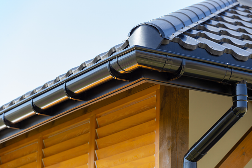 corner-new-modern-house-roof-gutter-wooden-shutter