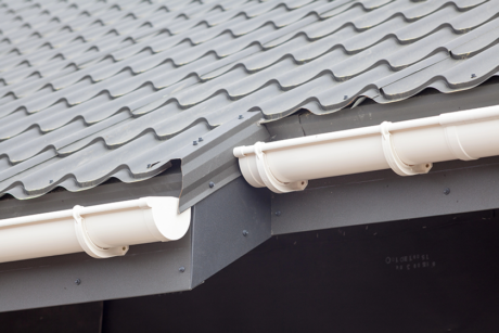 new-gray-metal-tile-roof-with-white-rain-gutter