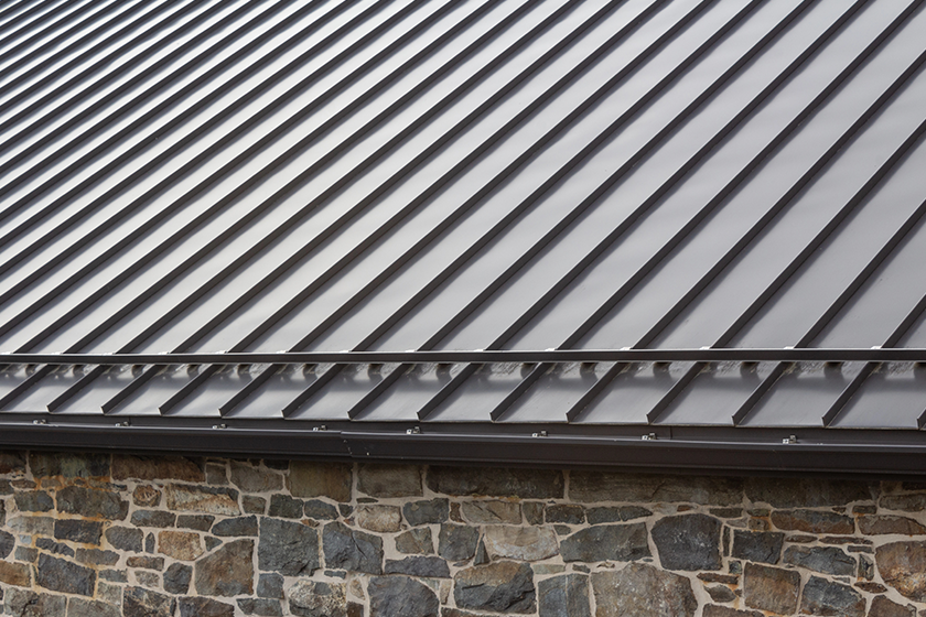 Standing seam modern metal roof over vintage